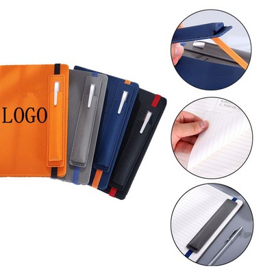 A hardcover notebook with a pencil case in the office