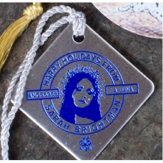 1.5" x 1.5" Diamond or square shaped ornament with a die struck imprint and metallic string