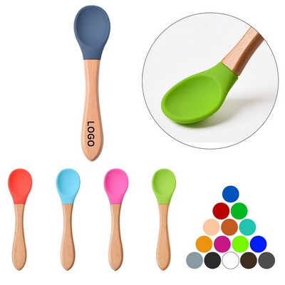 Silicone baby utensils with bamboo handles.