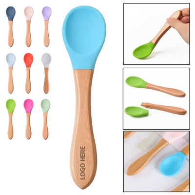 Silicone baby utensils with bamboo handles.