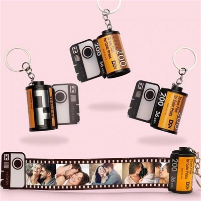 Durable Plastic Film Roll Key Chain With Pull Out Picture Strip